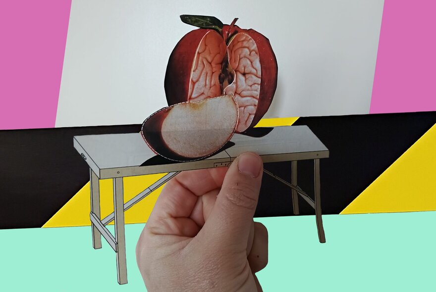 A collage image of a hand holding a science lab table with a cut apple sitting on top that looks like a human brain.