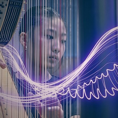A young woman playing the harp with an overlay of neon purple wings and curved string running through the image. 