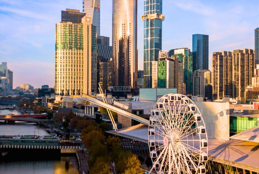 Docklands Ferris wheel with skyscrapers in the background.