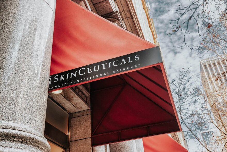 Skinceuticals covered street doorway with signage.