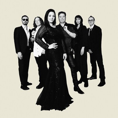 Members of group Seventh Wonder in a black and white images imposed on a beige background. 