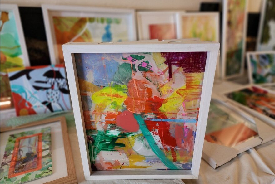 Colourful framed artworks.