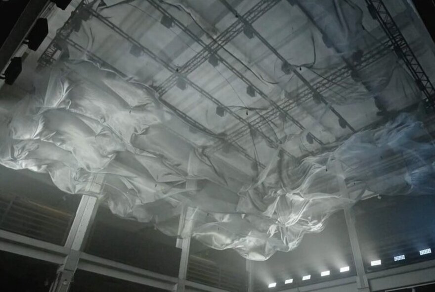 A grey fabric installation on a ceiling.