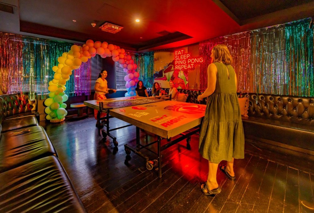 Two people playing table tennis