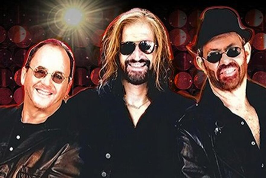 Australian tribute band Bee Gees Revival portraying the iconic trio of Barry, Robin, and Maurice Gibb, against a dark background.
