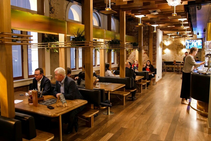 Tables inside a traditional, but spacious, pub.