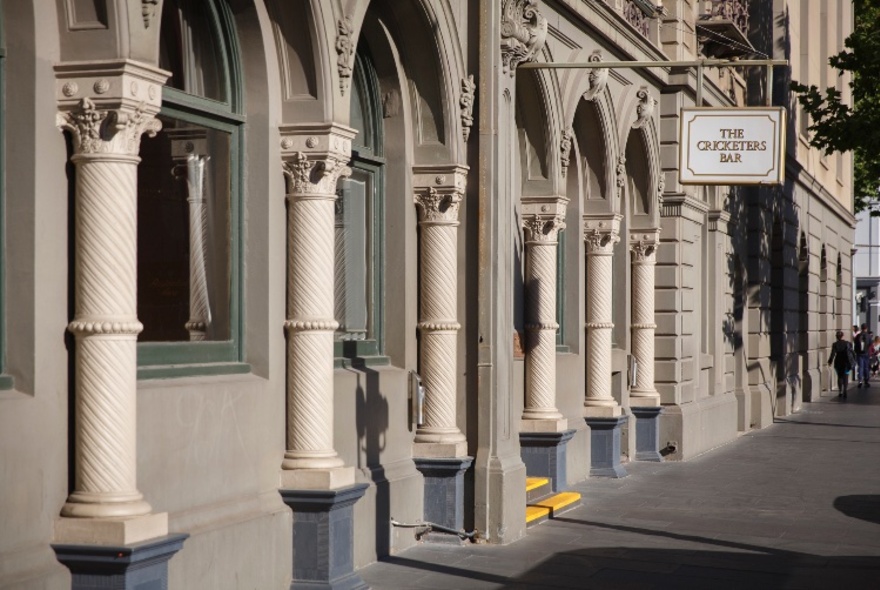 Spring Street, with Cricketer's Bar sign above door.