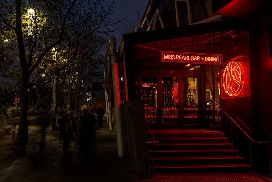 Moody neon-lit entry to Miss Pearl Bar on Southbank.