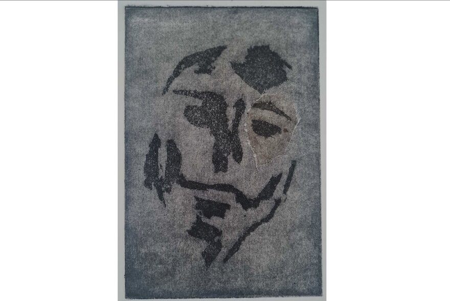 A monotone abstract print partially resembling a face.