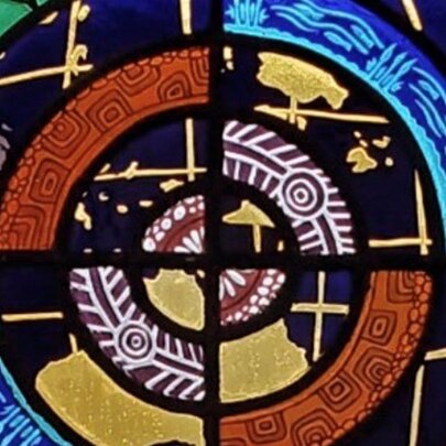 Colourful glass artwork of four distinct panels.