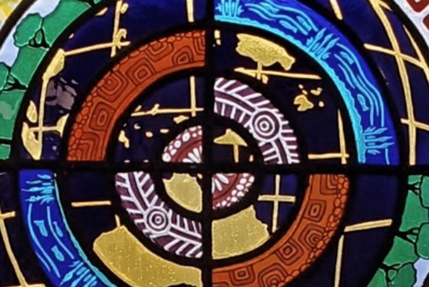 Colourful glass artwork of four distinct panels.