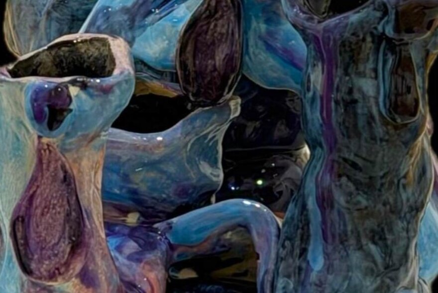 Abstract ceramic artwork in blues and purples.