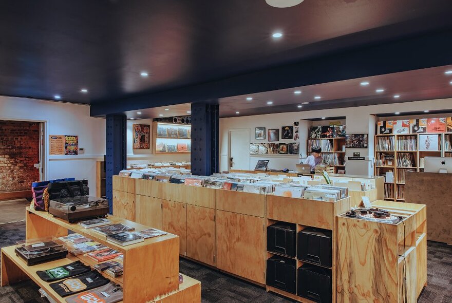 A record store with wooden shelving.