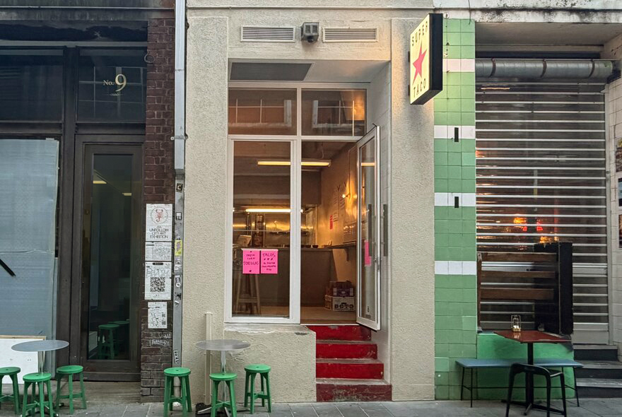 The exterior of a tiny taco shop.