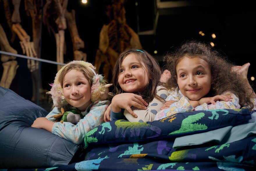 Children lying in sleeping bags at the museum.