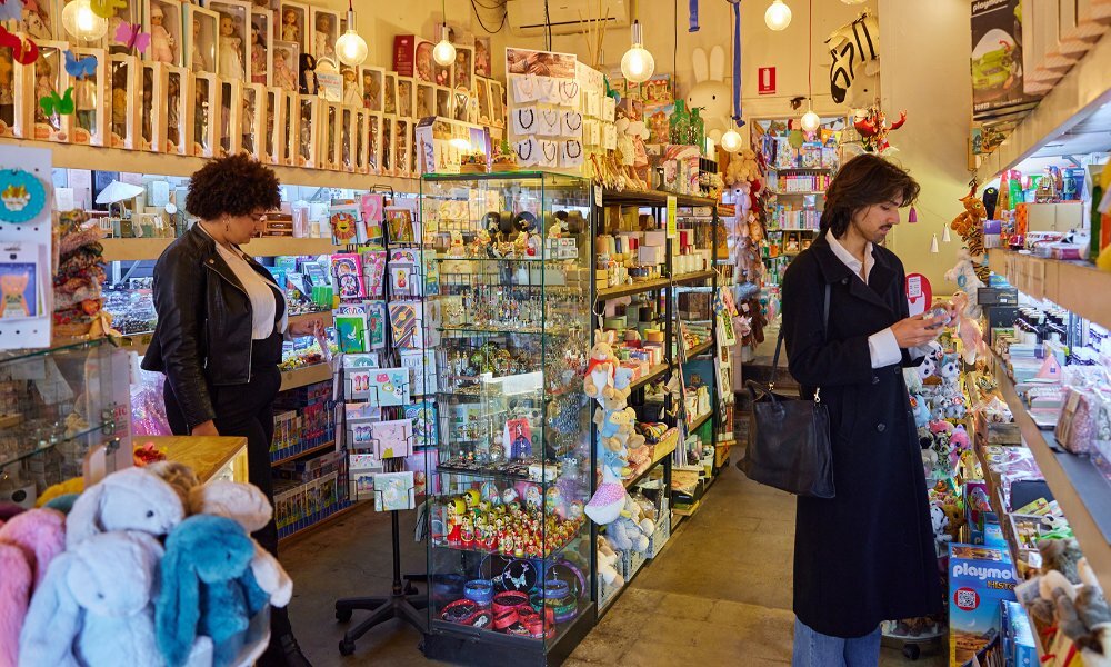 Two people browsing in a toy shop.