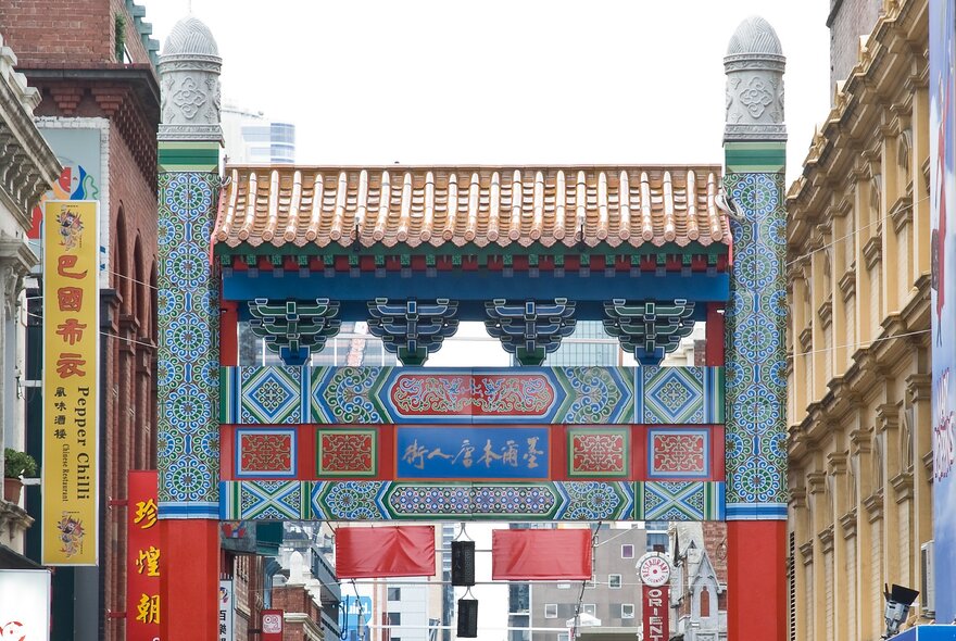 A photo of the top half of one of the Chinese arches in Chinatown in Melbourne.