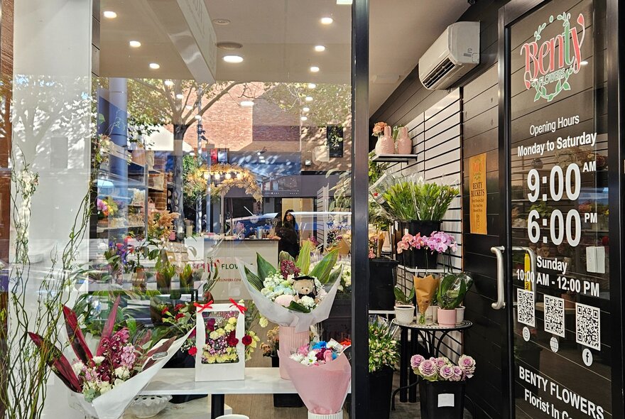 The window-front of Benty Flowers, with sample bouquets in the window.
