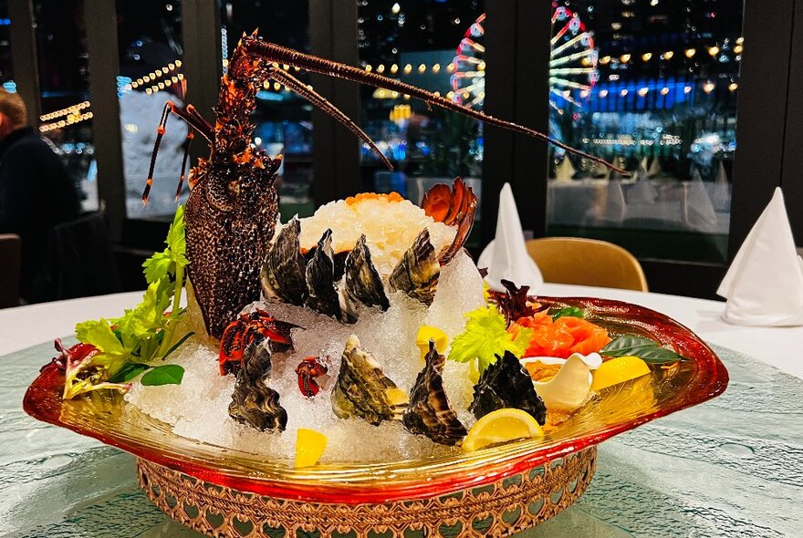 A dish of seafood presented on ice.