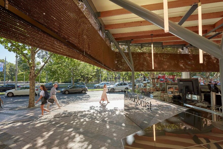 View of St Kilda Road and pedestrians from café.