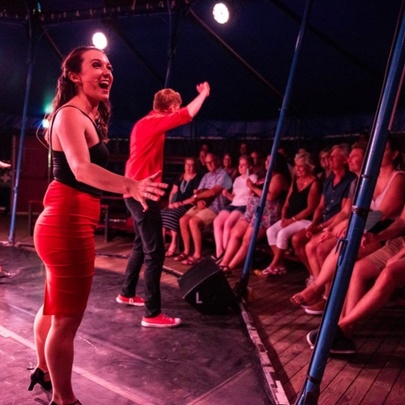 A live performance in front of an audience by Impromptunes, an Australian improvised musical comedy troupe.