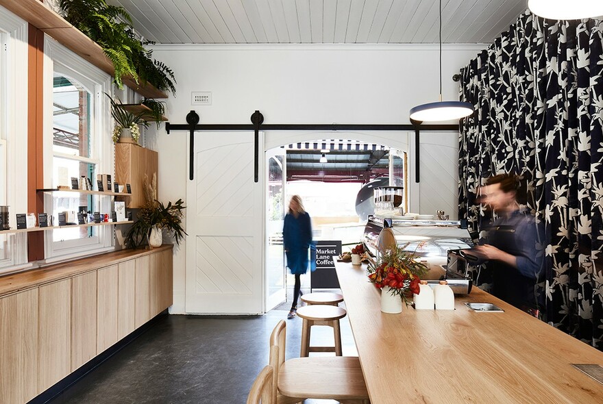 Stools and serving bench in a coffee shop.