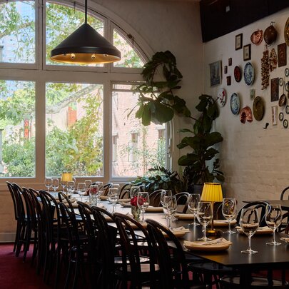 A long table in a restaurant.