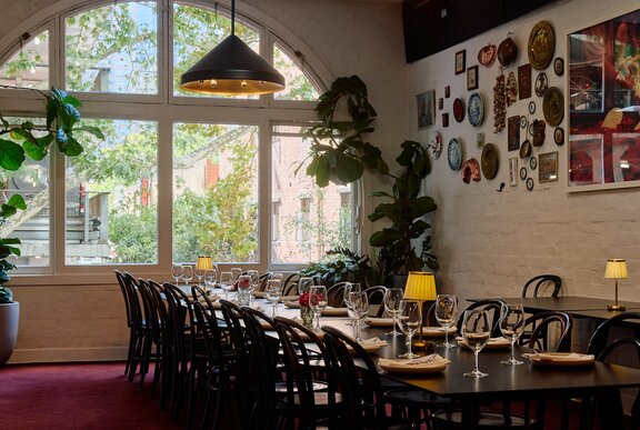 A long table in a restaurant.