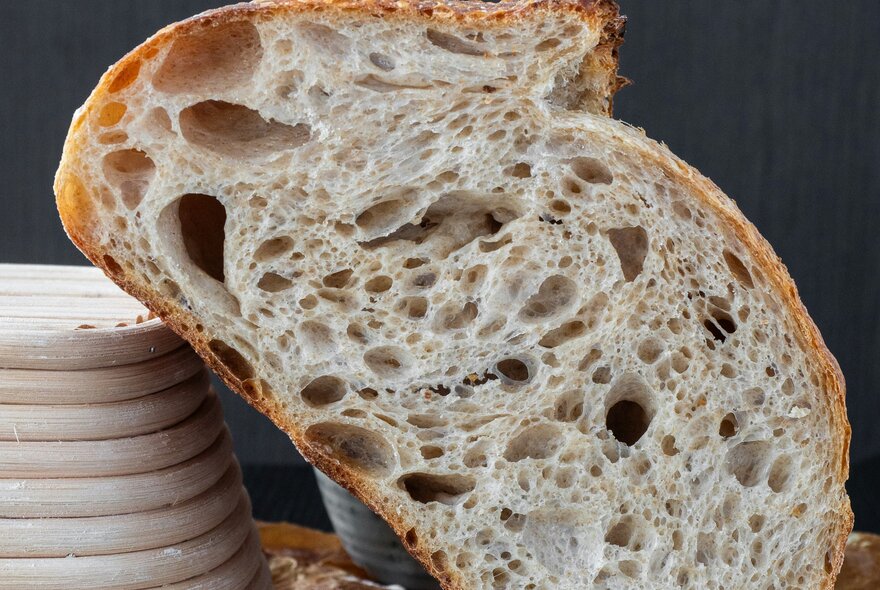 A loaf of sourdough bread cut in half.