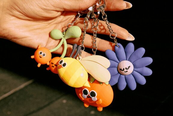 Hanging bag tags with flowers and bees.