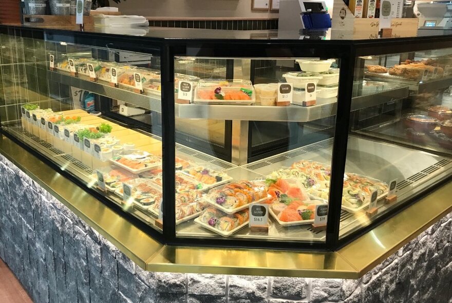 The inside of a sushi counter at a Japanese cafe.