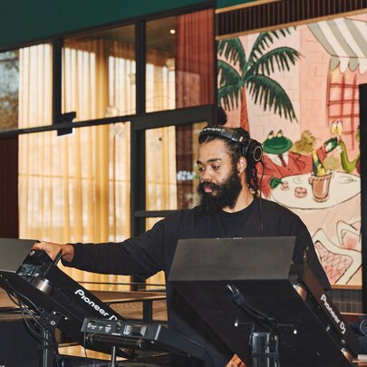 A DJ performing in a restaurant.