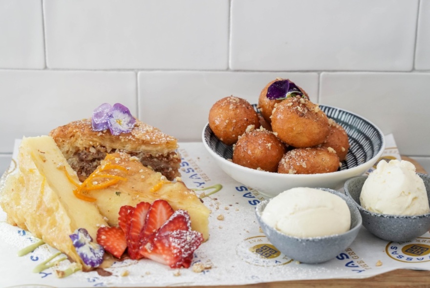 Greek desserts including loukoumades, ice cream and cakes. 