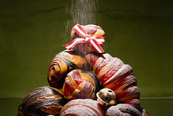 A stack of baked Christmas pastries.