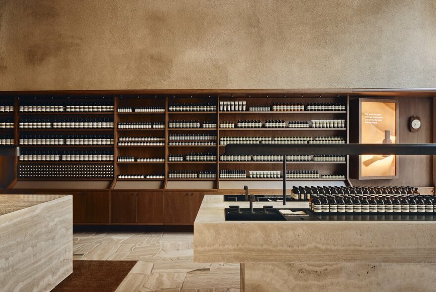 Shelves of Aesop products in a sleekly designed store. 