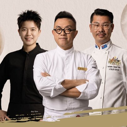 Three acclaimed chefs of Chinese heritage standing together, the middle chef with his arms crossed. 