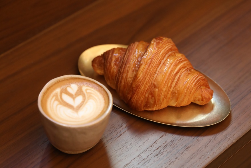 A coffee and a croissant.