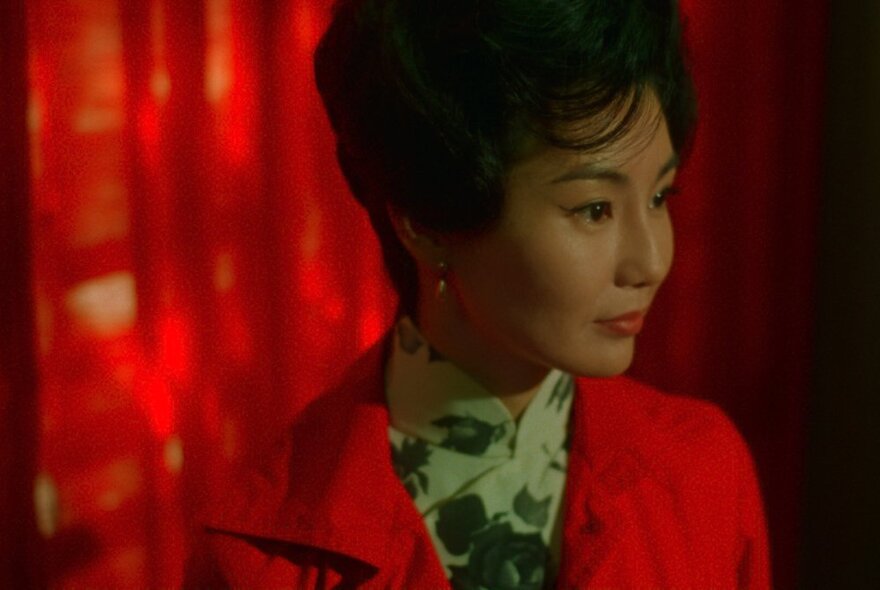 A still image of a woman in 1960s attire from the movie In the Mood For Love.