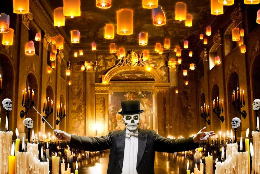 A classical music conductor wearing a tuxedo and top hat with his face painted like a skull, in a chamber filled with candles and floating lanterns.