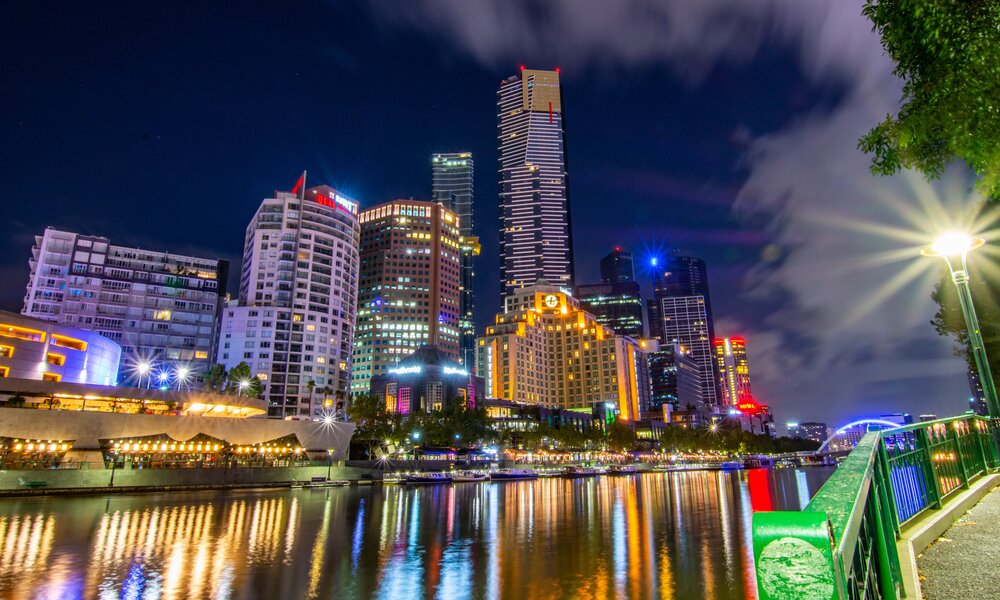 A view of the Southbank city skyline and Yarra River at night.