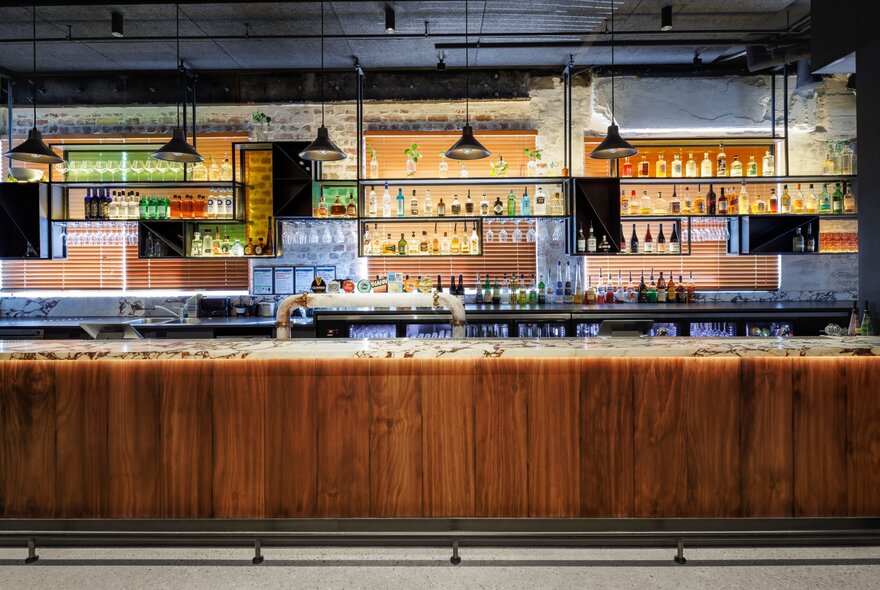 The empty bar of the Metropolitan Hotel with timber finishes.