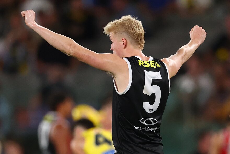 AFL football player on the field during a match.
