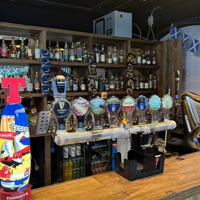 A beer tap at a bar.