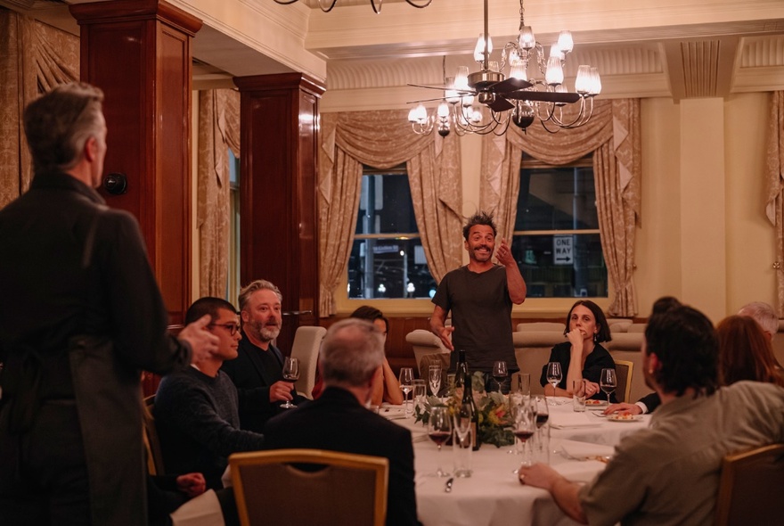 Actors performing in a play that takes place in a hotel dining room. 