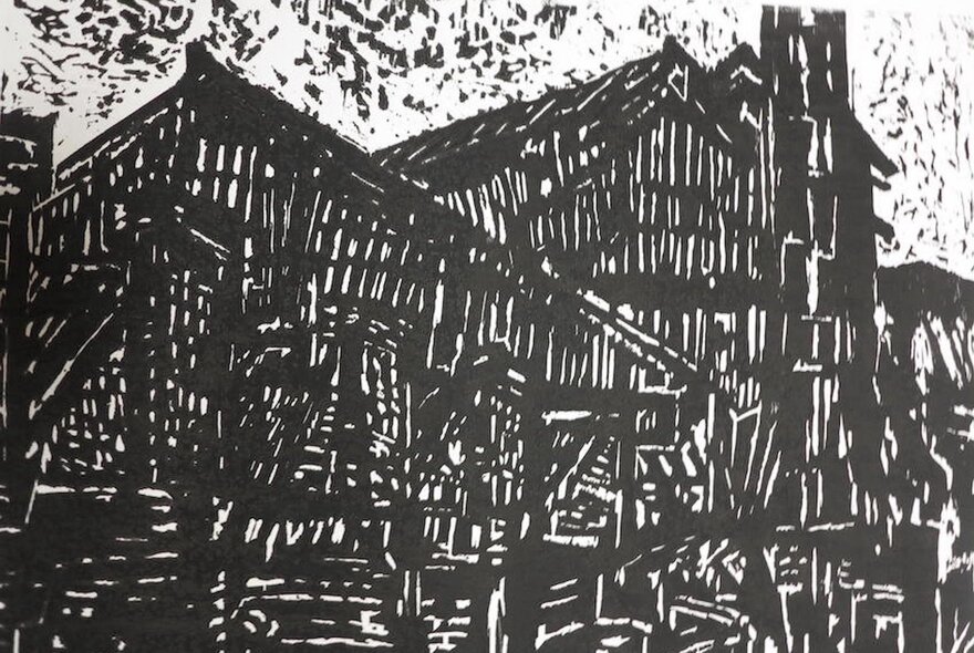 A black and white woodcut print of structures against a sky.