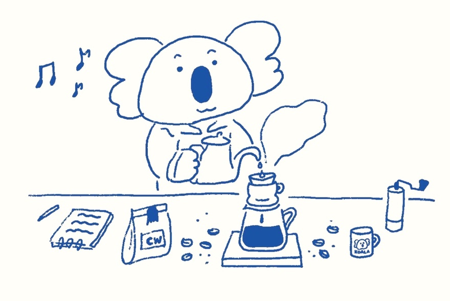 A drawing in blue ink of a koala making a filter or pour over coffee, with a notepad, bag of coffee beans and other items on the table in front of the koala.