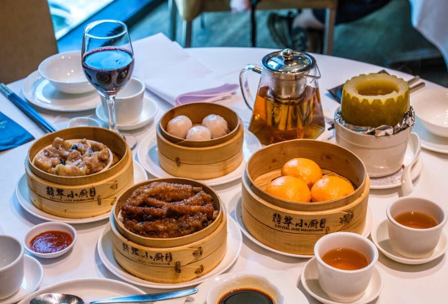Bamboo baskets of dumplings on a white table