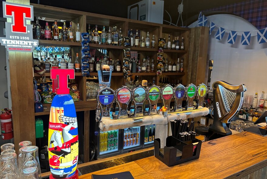 Bar with British flags and lagers on tap.