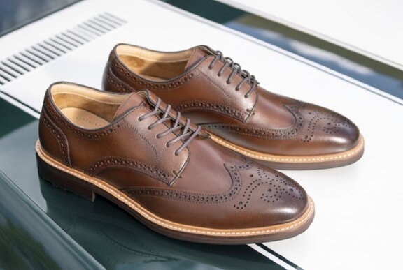 A pair of brown leather brogues.