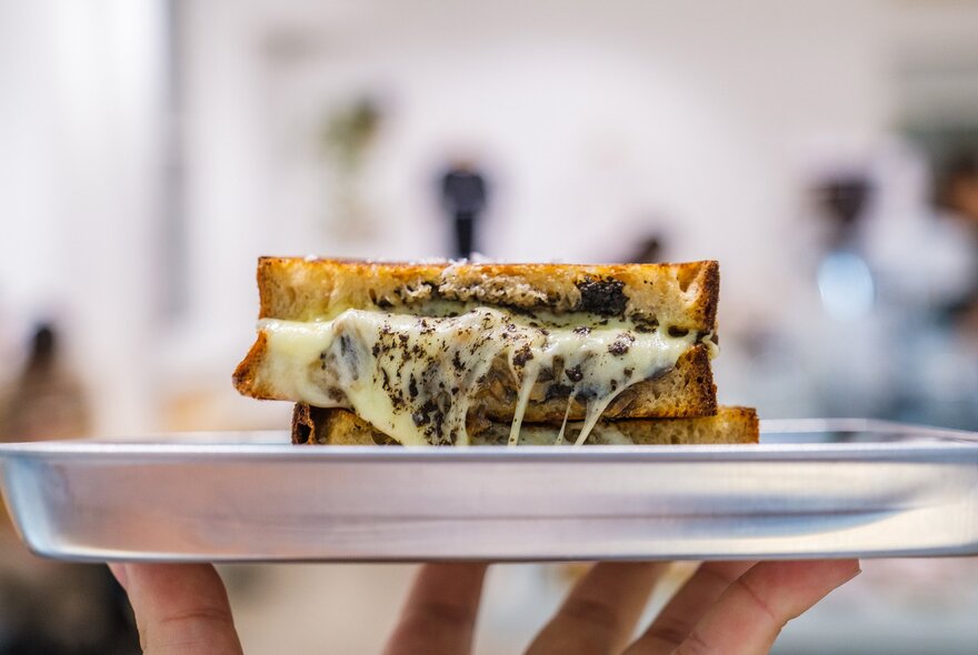 A truffle toastie on a silver tray